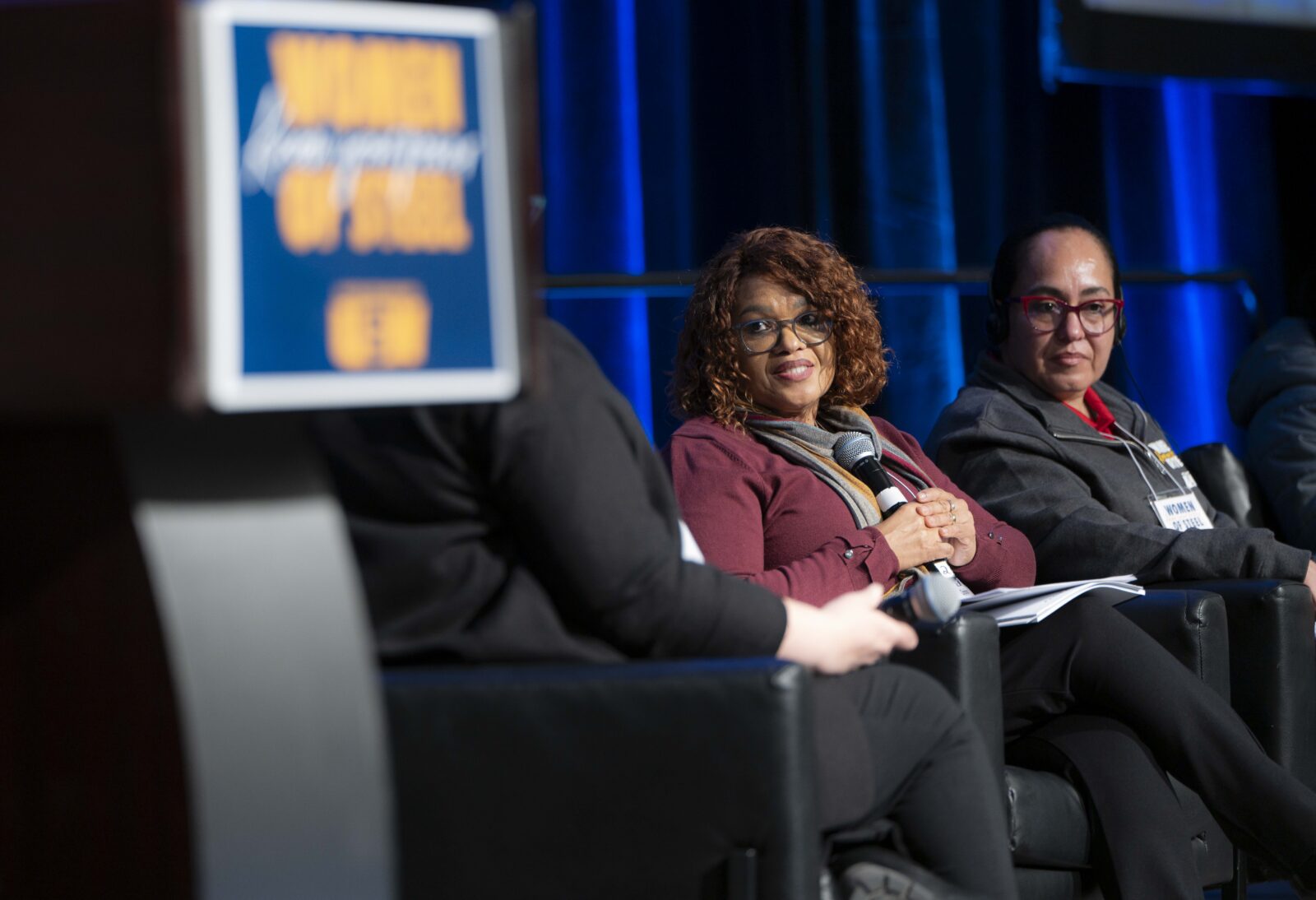Two women speak on a panel at the USW Women of Steel Conference in Toronto, March 2026.